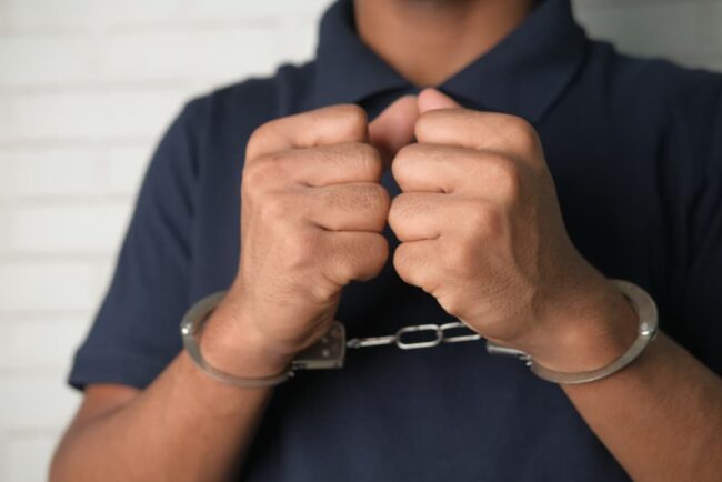 What Should You Do If You’re Arrested in Michigan Man in black shirt with handcuff after arrest