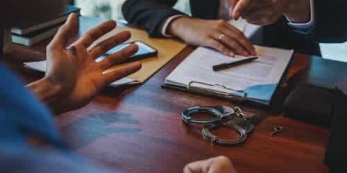 probation violation client discussing probation violation with lawyer