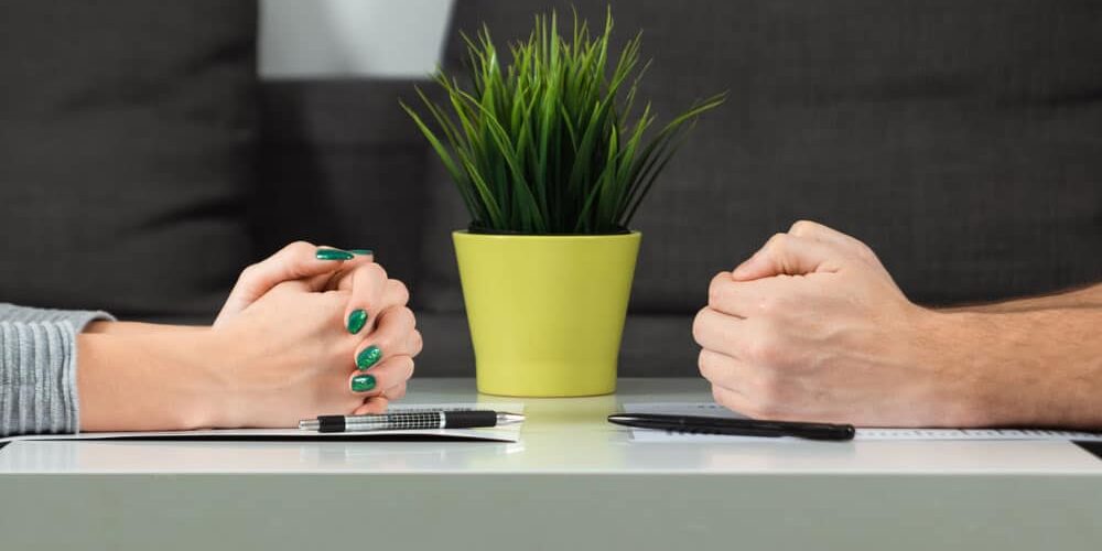 Male-and-female-hands-are-folded-opposite-each-other Does Michigan Favor Moms or Dads in Custody Cases? What the Law Actually Says