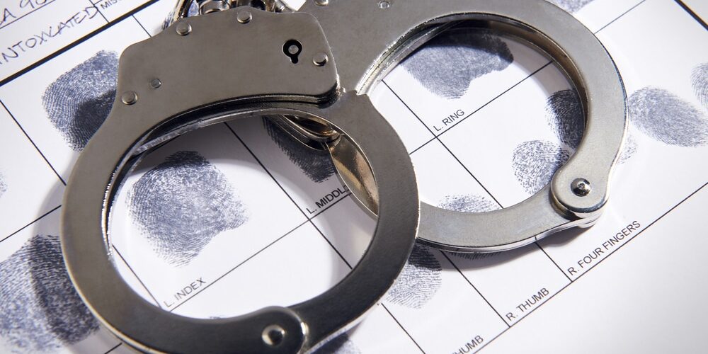 Handcuffs,On,Top,Of,A,Set,Of,Fingerprints