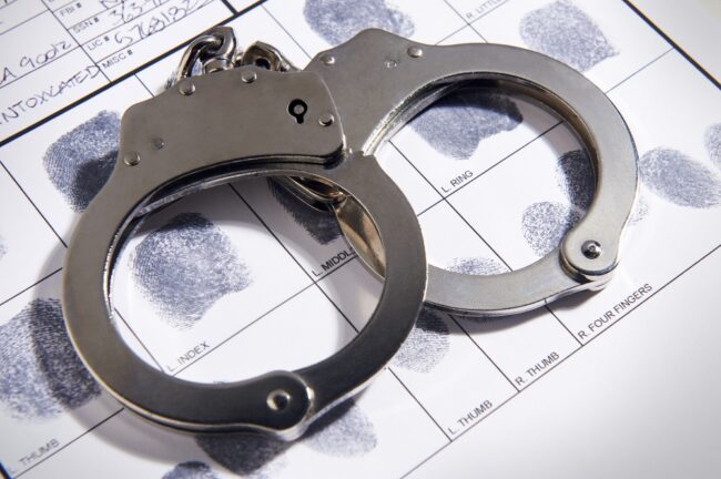 Handcuffs,On,Top,Of,A,Set,Of,Fingerprints