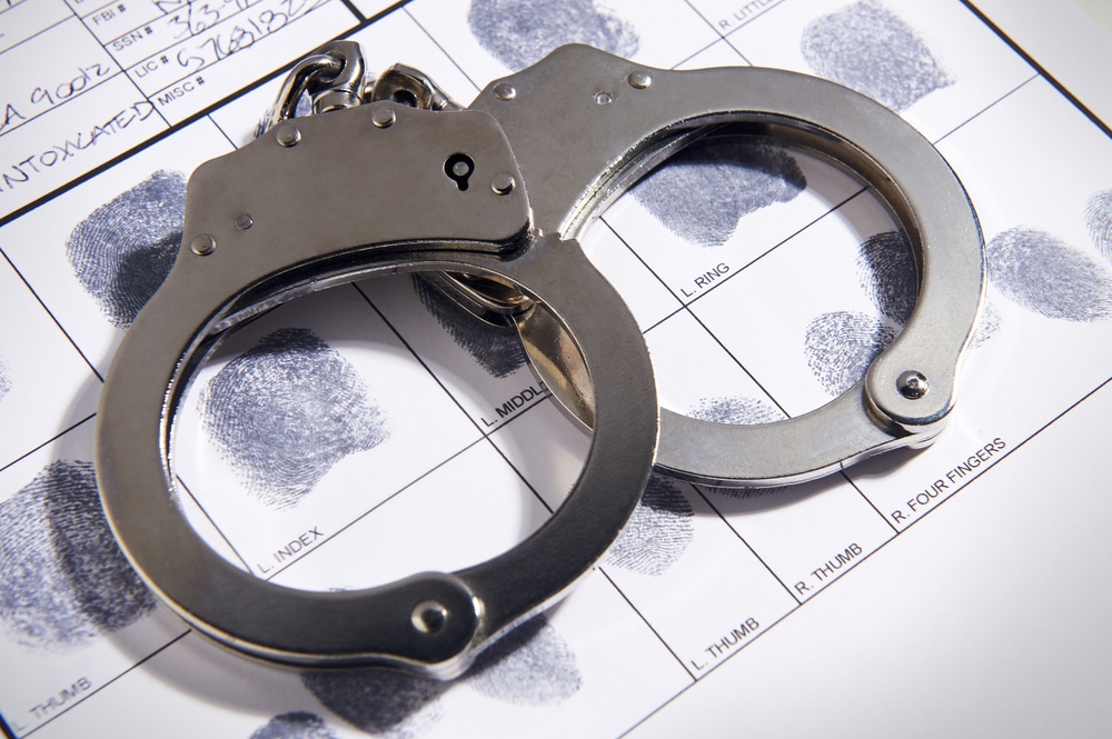 Handcuffs,On,Top,Of,A,Set,Of,Fingerprints
