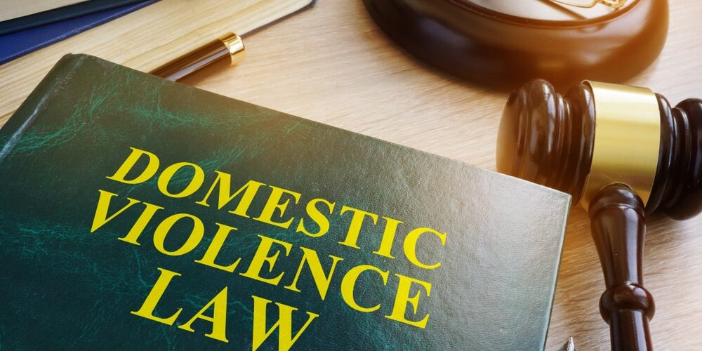Domestic,Violence,Law,On,A,Wooden,Table. What Happens After a Domestic Violence Arrest in Michigan: The First 72 Hours Explained