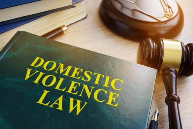 Domestic,Violence,Law,On,A,Wooden,Table. What Happens After a Domestic Violence Arrest in Michigan: The First 72 Hours Explained