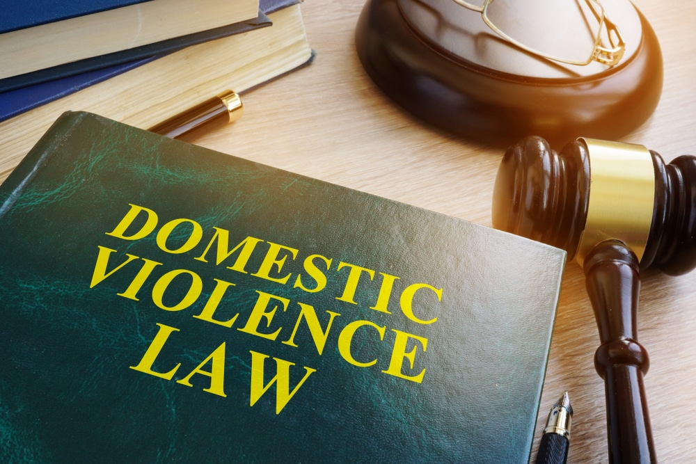 Domestic,Violence,Law,On,A,Wooden,Table. What Happens After a Domestic Violence Arrest in Michigan: The First 72 Hours Explained
