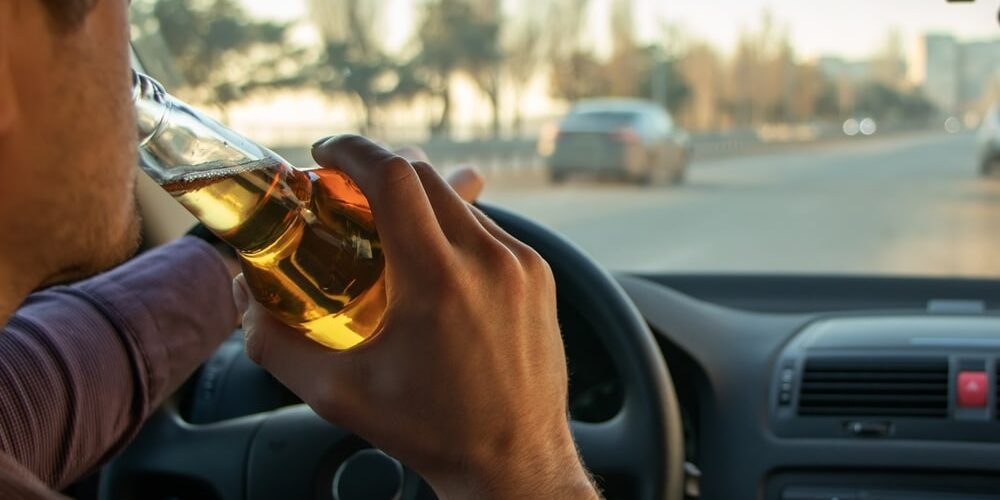 A,Man,Drinking,Alcohol,While,Driving.,Drunk,Driving,Concept.