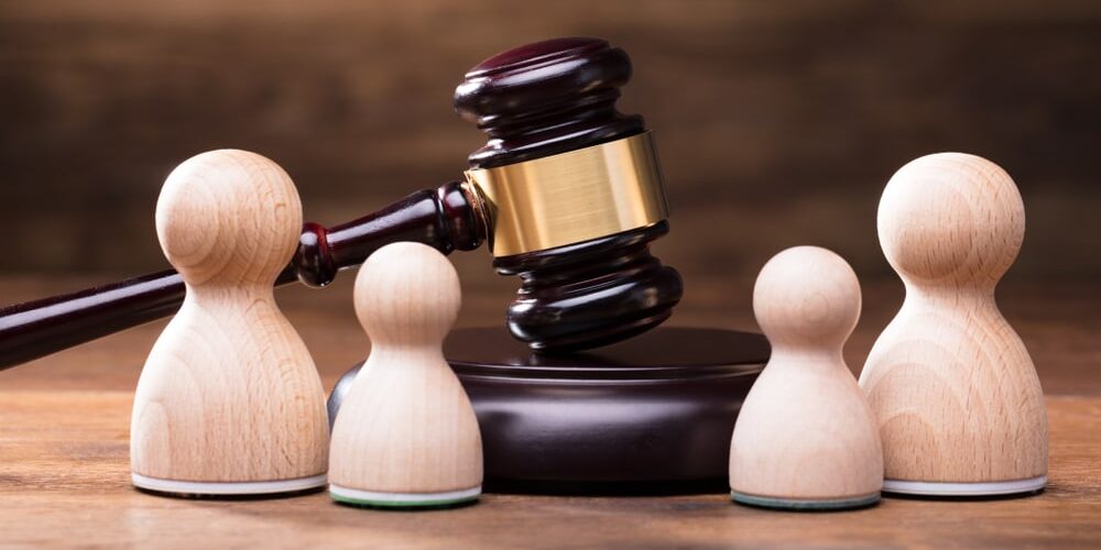 Separation Of Pawn Wooden Figure With Gavel